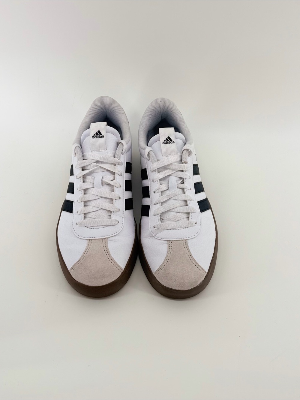 adidas White Trainers with Black Stripes and Brown Outsole